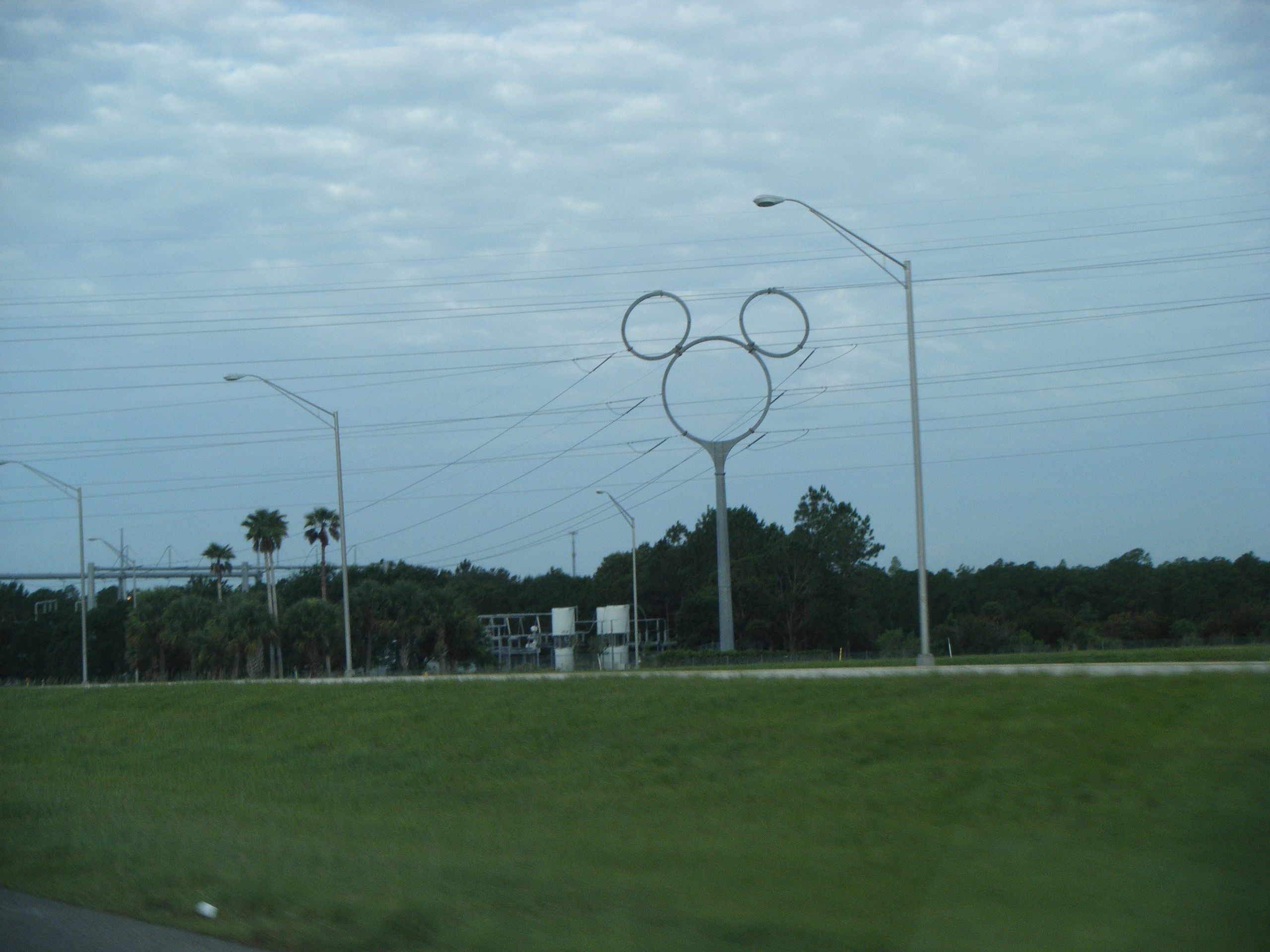 A metal pole with a large circle and two smaller circles as the ears